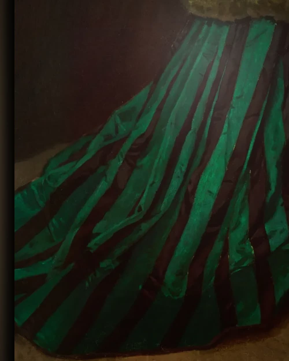 Materiaal en afwerking van Camille, de vrouw in de groene jurk in het wisselframe