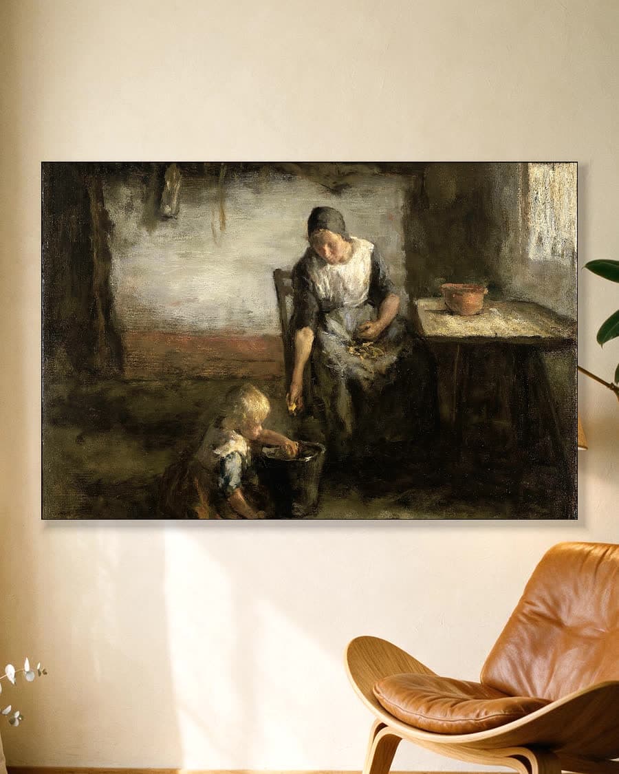De aardappelschilster in een aluminium frame aan dezelfde muur