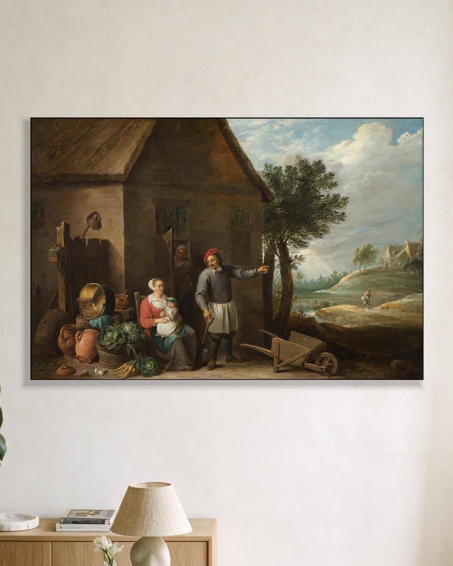 Een landman met een vrouw en kind in een aluminium frame aan dezelfde muur