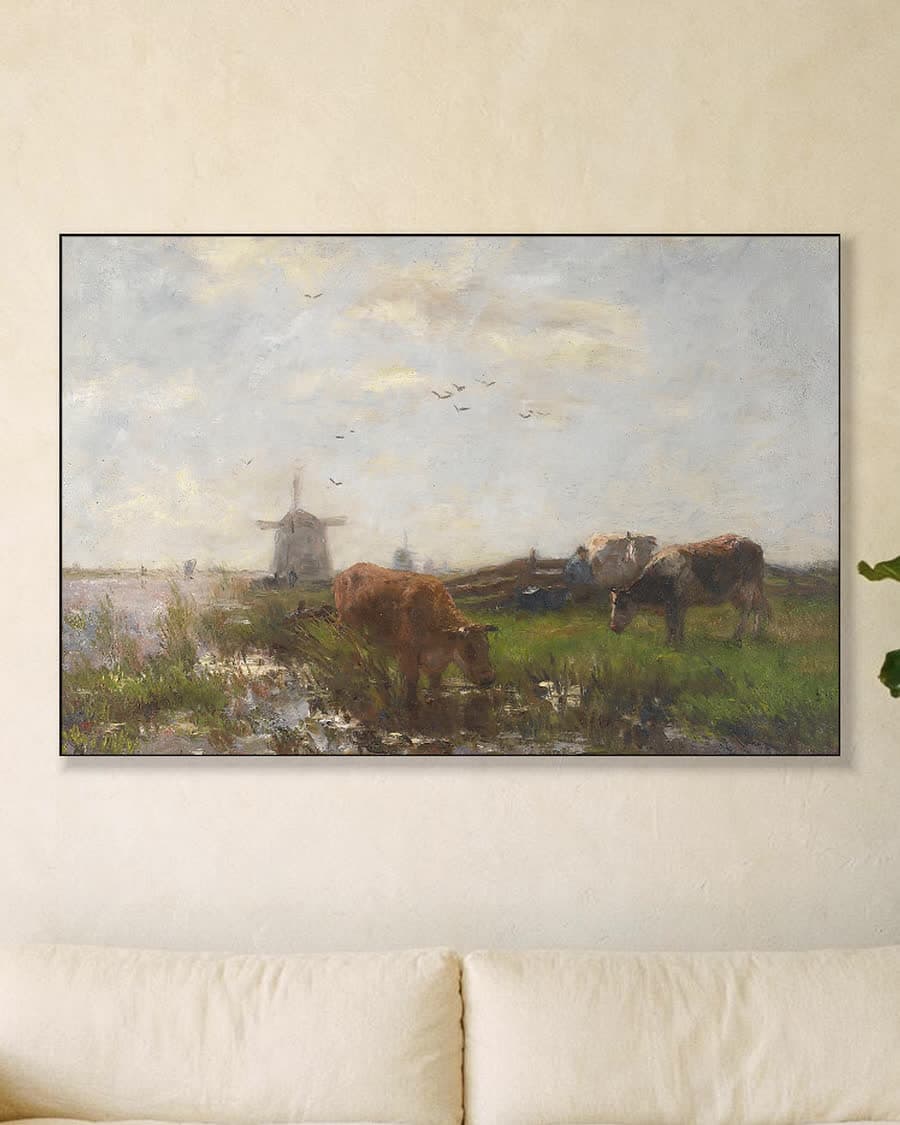Grazend vee aan de waterkant in een aluminium frame aan dezelfde muur