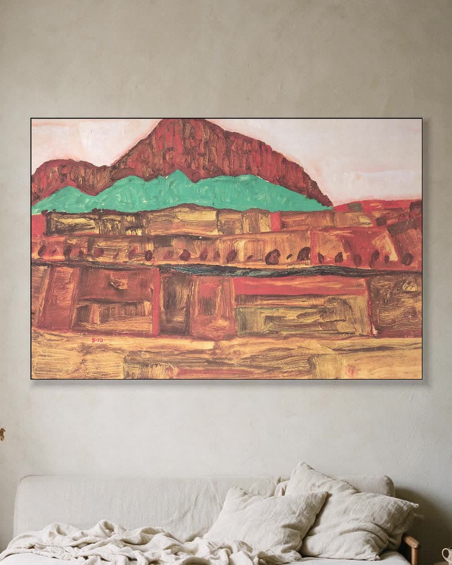 Berglandschap in een aluminium frame aan dezelfde muur