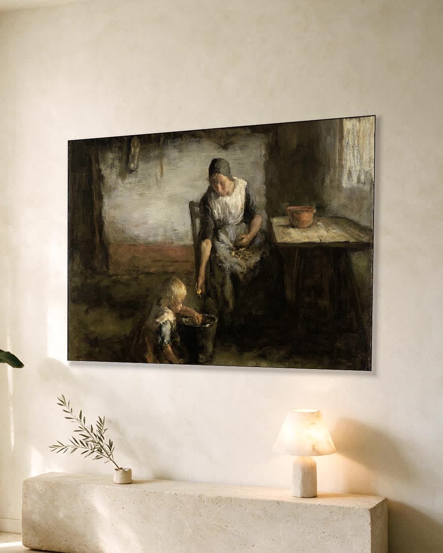 De aardappelschilster in een aluminium frame aan dezelfde muur