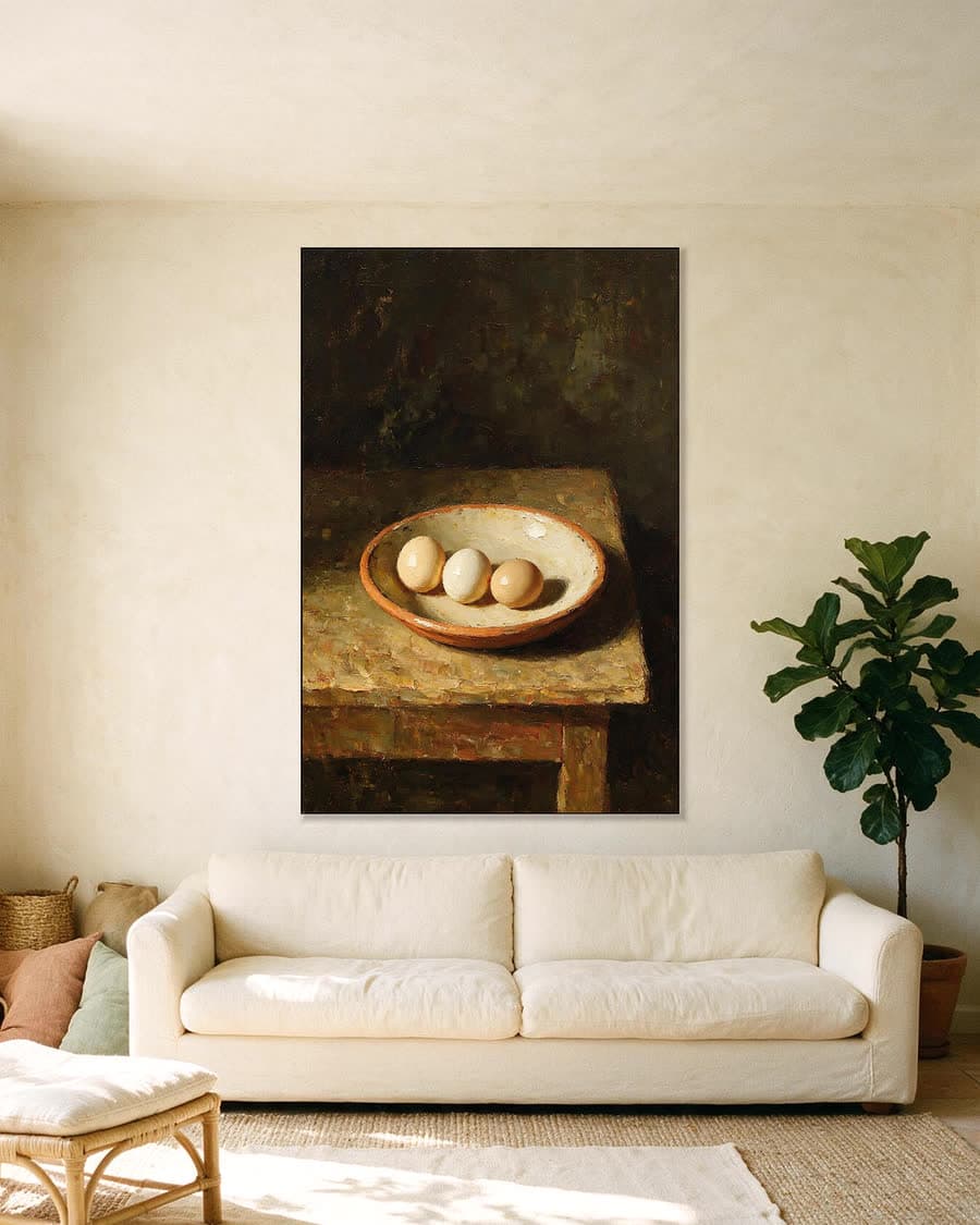 Drie eieren in een aluminium frame aan dezelfde muur