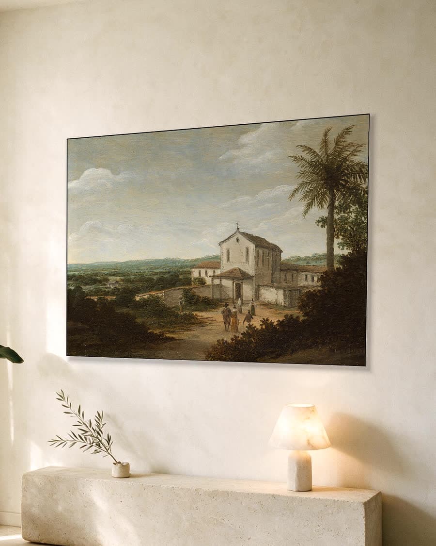 Landelijk tafereel met kerk in een aluminium frame aan dezelfde muur