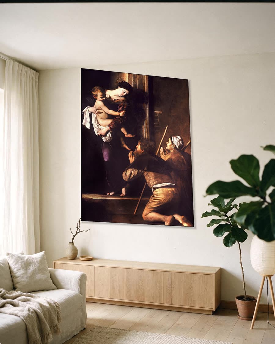 De Madonna van de pelgrims in een aluminium frame aan dezelfde muur