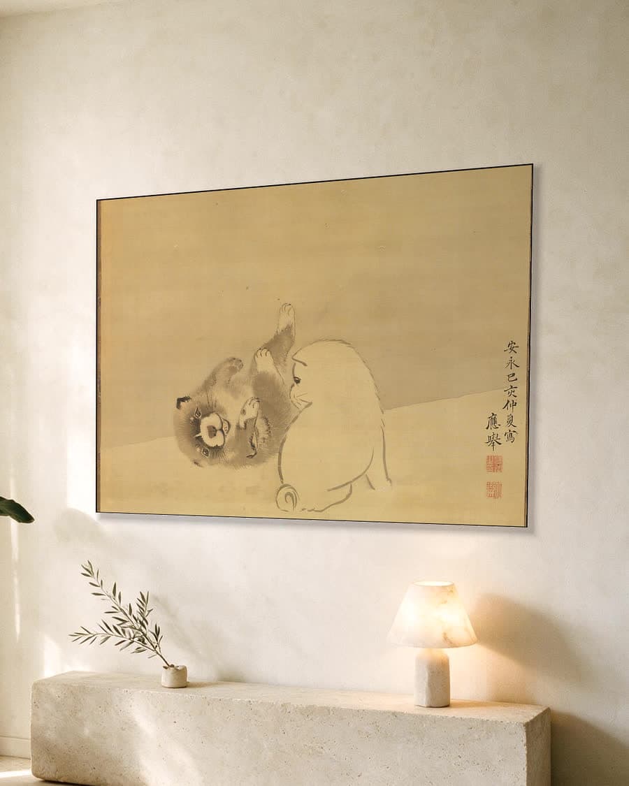 Twee spelende pups in een aluminium frame aan dezelfde muur
