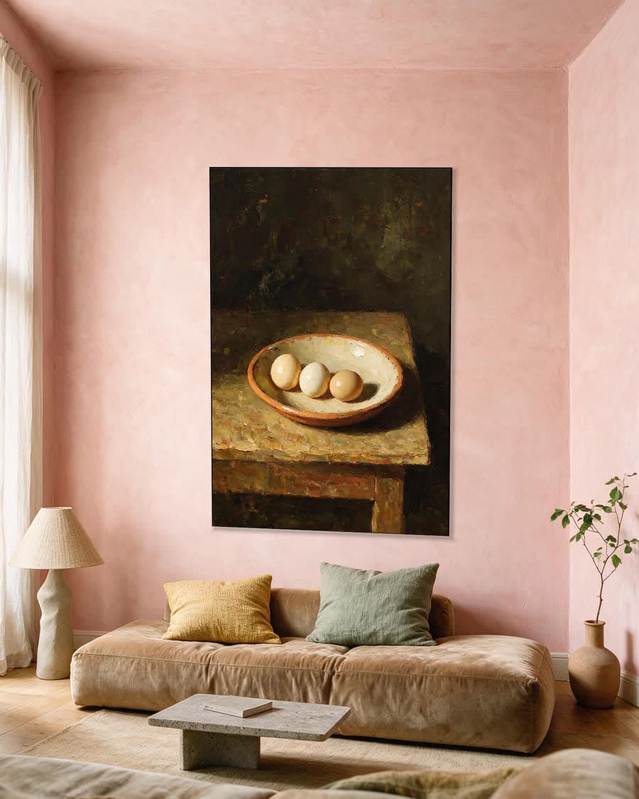 Drie eieren in een aluminium frame aan dezelfde muur