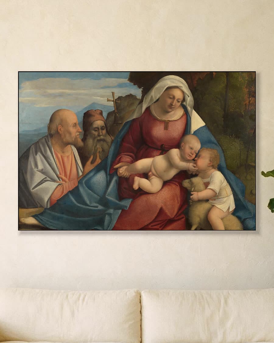 Madonna met kind, de kleine Johannes de Doper en de heiligen Petrus en Antonius in een aluminium frame aan dezelfde muur
