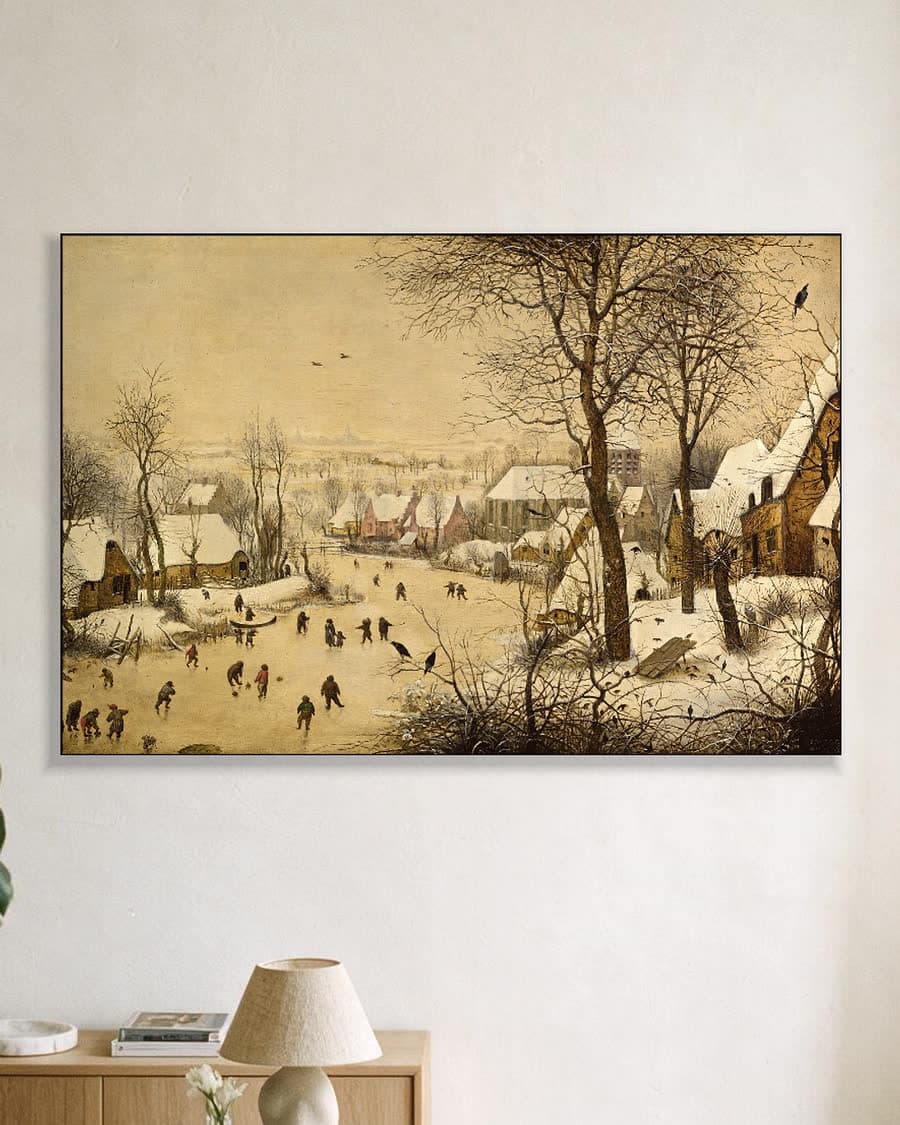 Winterlandschap met schaatsers en vogelknip in een aluminium frame aan dezelfde muur