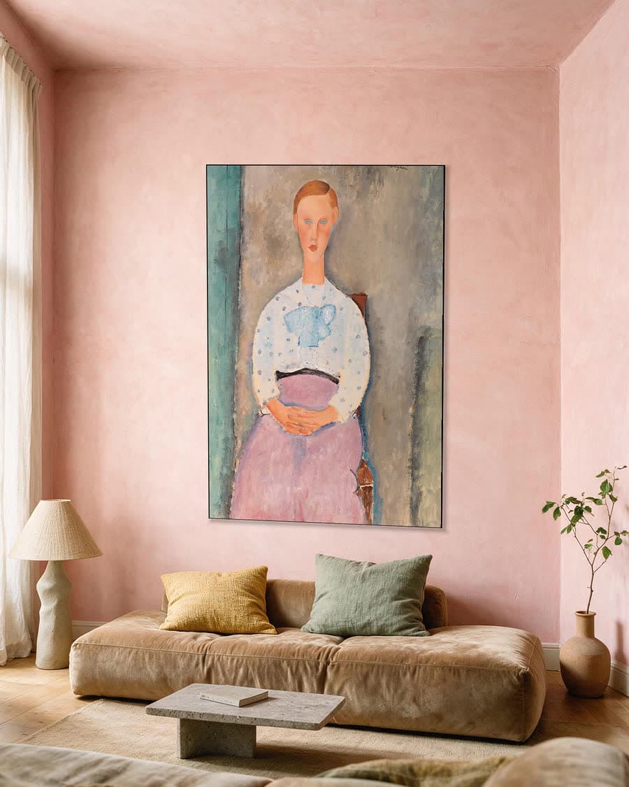 Meisje met gestippelde blouse in een aluminium frame aan dezelfde muur