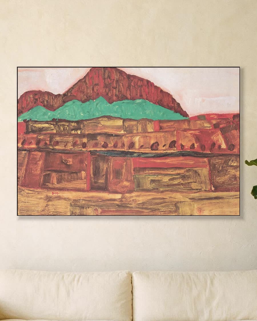 Berglandschap in een aluminium frame aan dezelfde muur