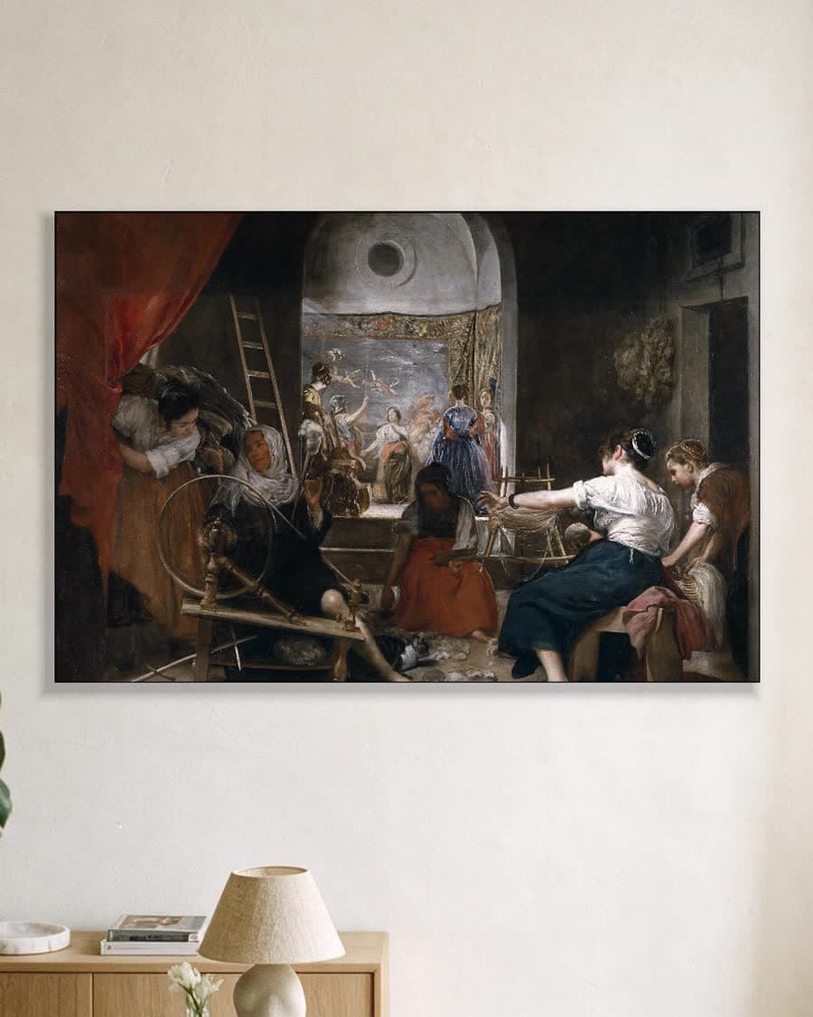 De Spinsters (Fabel van Arachne) in een aluminium frame aan dezelfde muur