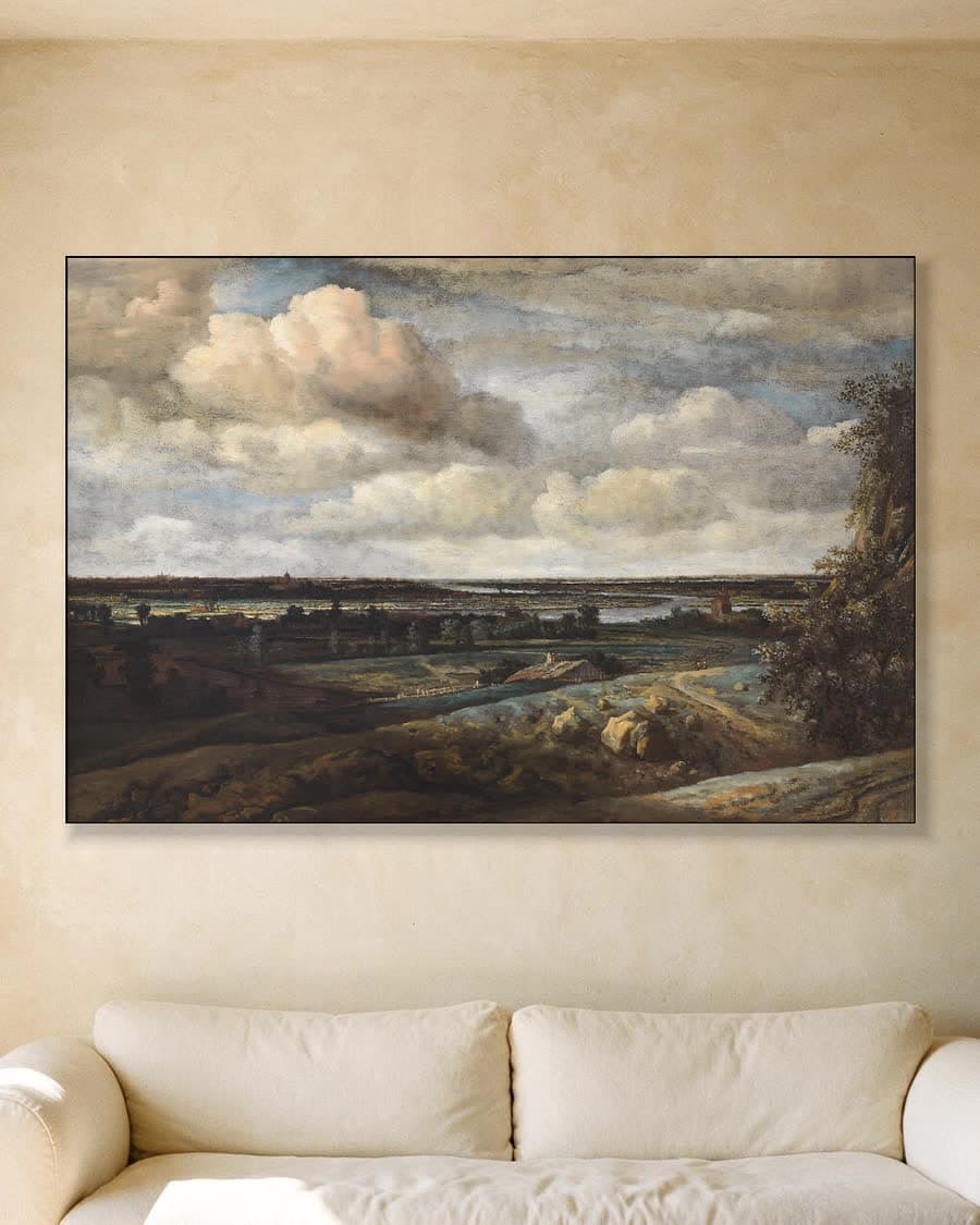 Panoramalandschap met Haarlem in de verte (1654) in een aluminium frame aan dezelfde muur