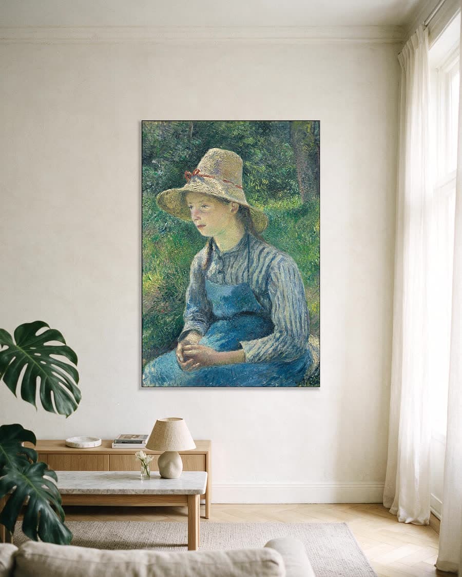 Boerenmeisje met strohoed in een aluminium frame aan dezelfde muur