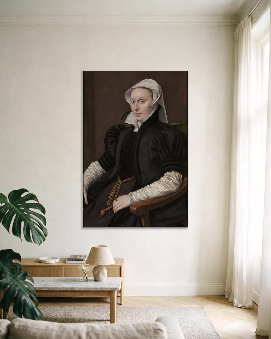 Portretten van Sir Thomas Gresham en Anne Fernely in een aluminium frame aan dezelfde muur