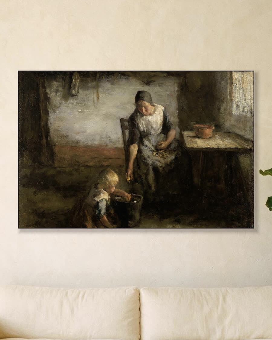 De aardappelschilster in een aluminium frame aan dezelfde muur