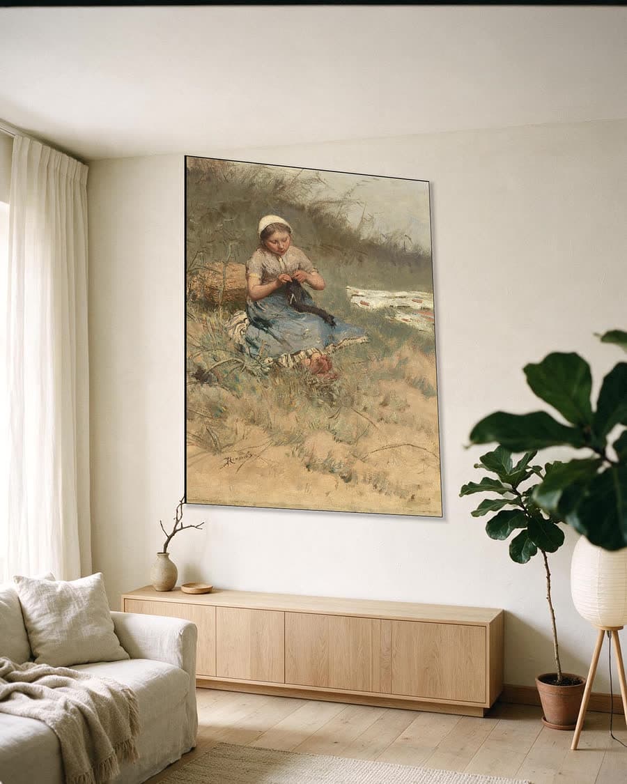 Het breistertje in een aluminium frame aan dezelfde muur