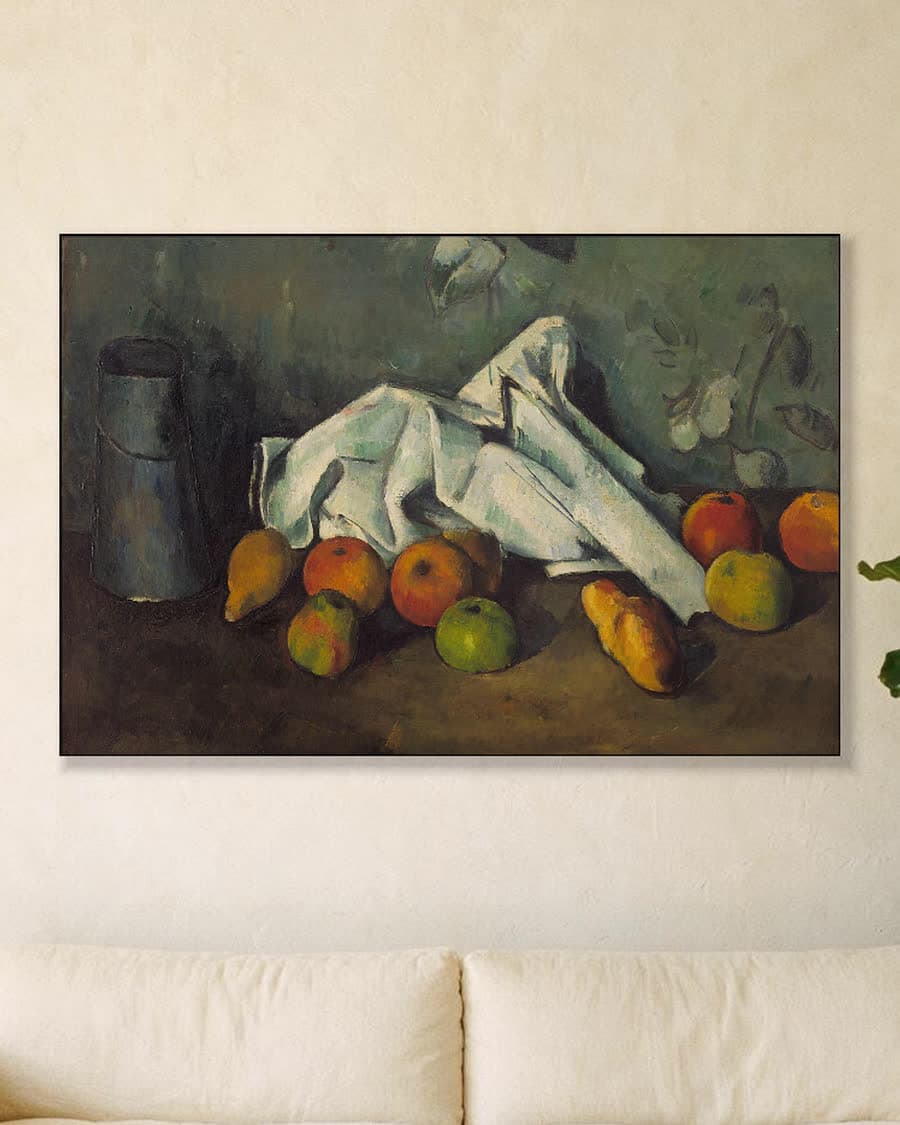 Melkkan en appels in een aluminium frame aan dezelfde muur