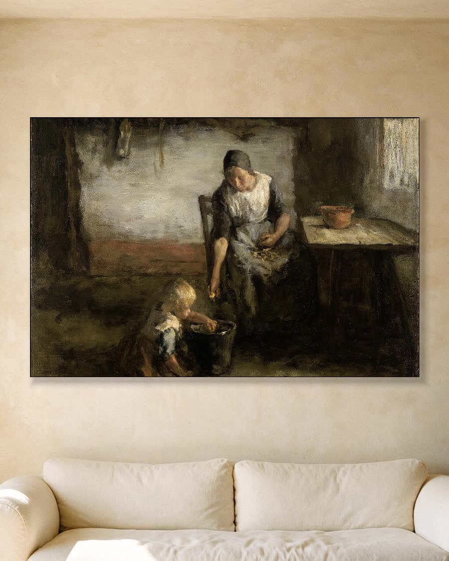 De aardappelschilster in een aluminium frame aan dezelfde muur