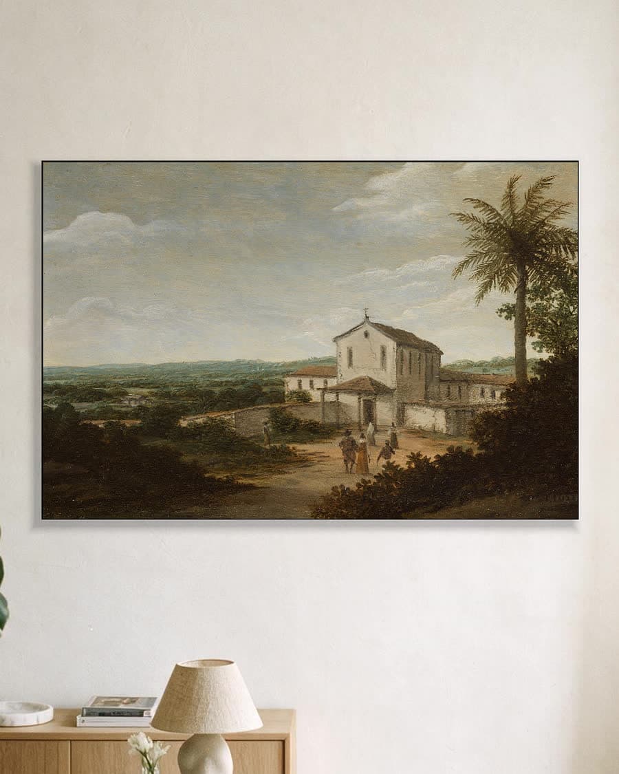 Landelijk tafereel met kerk in een aluminium frame aan dezelfde muur