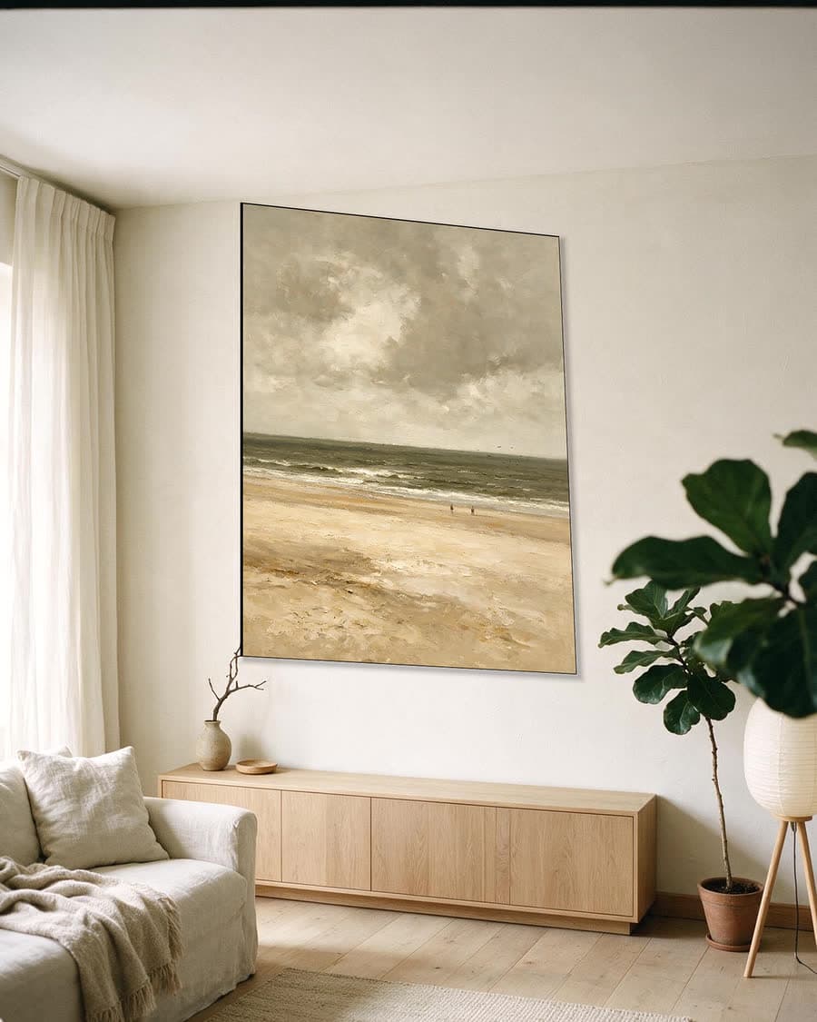 Twee figuren aan zee in een aluminium frame aan dezelfde muur