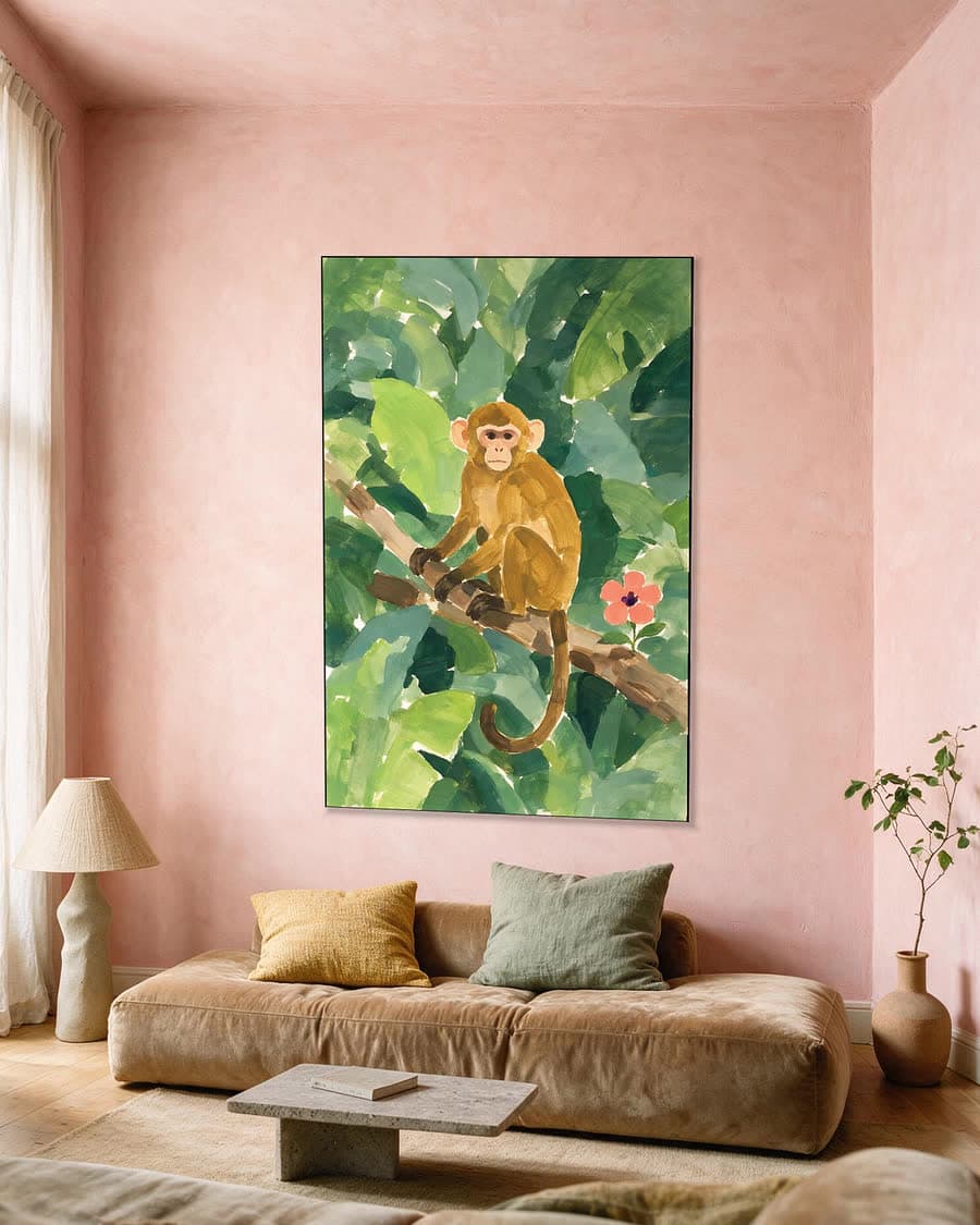 Aapje op een tak in een aluminium frame aan dezelfde muur