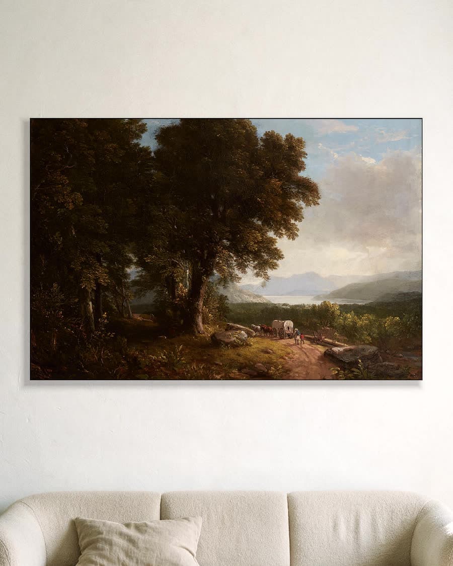 Wagen op bospad met bergmeer in een aluminium frame aan dezelfde muur