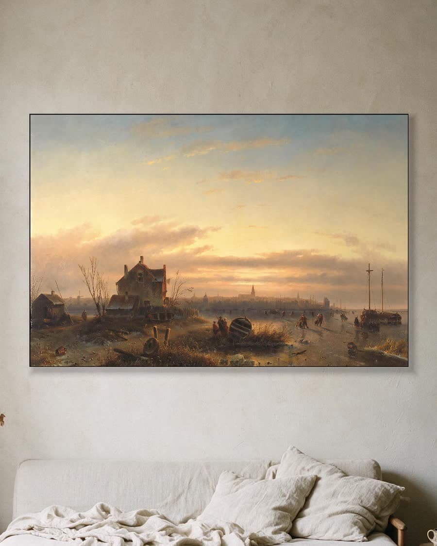 Wintergezicht met schaatsers bij ondergaande zon in een aluminium frame aan dezelfde muur