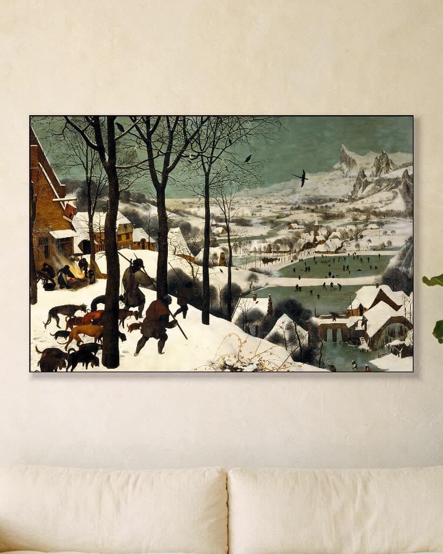 Winterlandschap met Jagers in een aluminium frame aan dezelfde muur