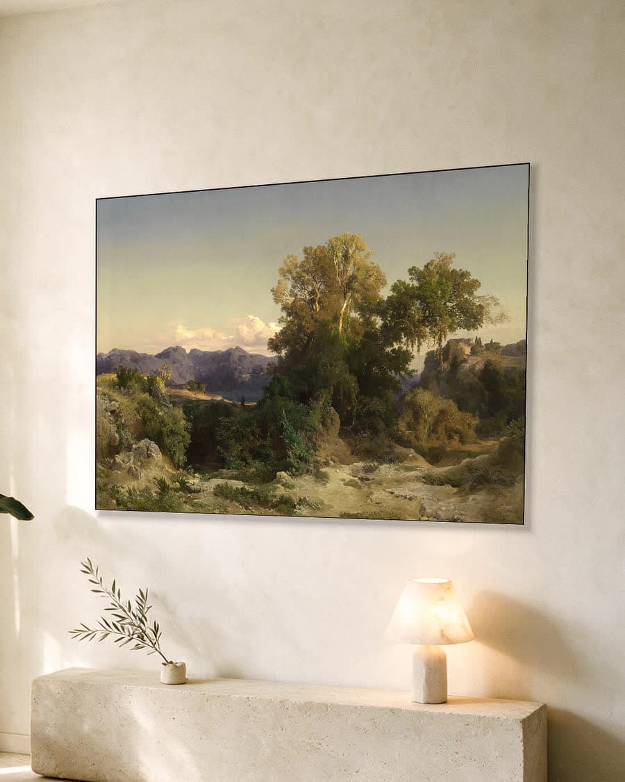 Zonnig berglandschap in een aluminium frame aan dezelfde muur