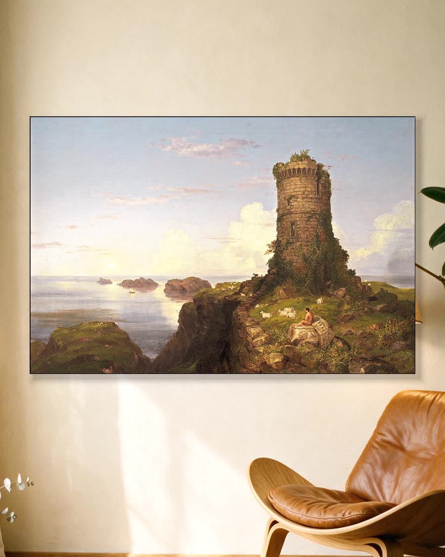 Kustlandschap met herder en ruïne in een aluminium frame aan dezelfde muur