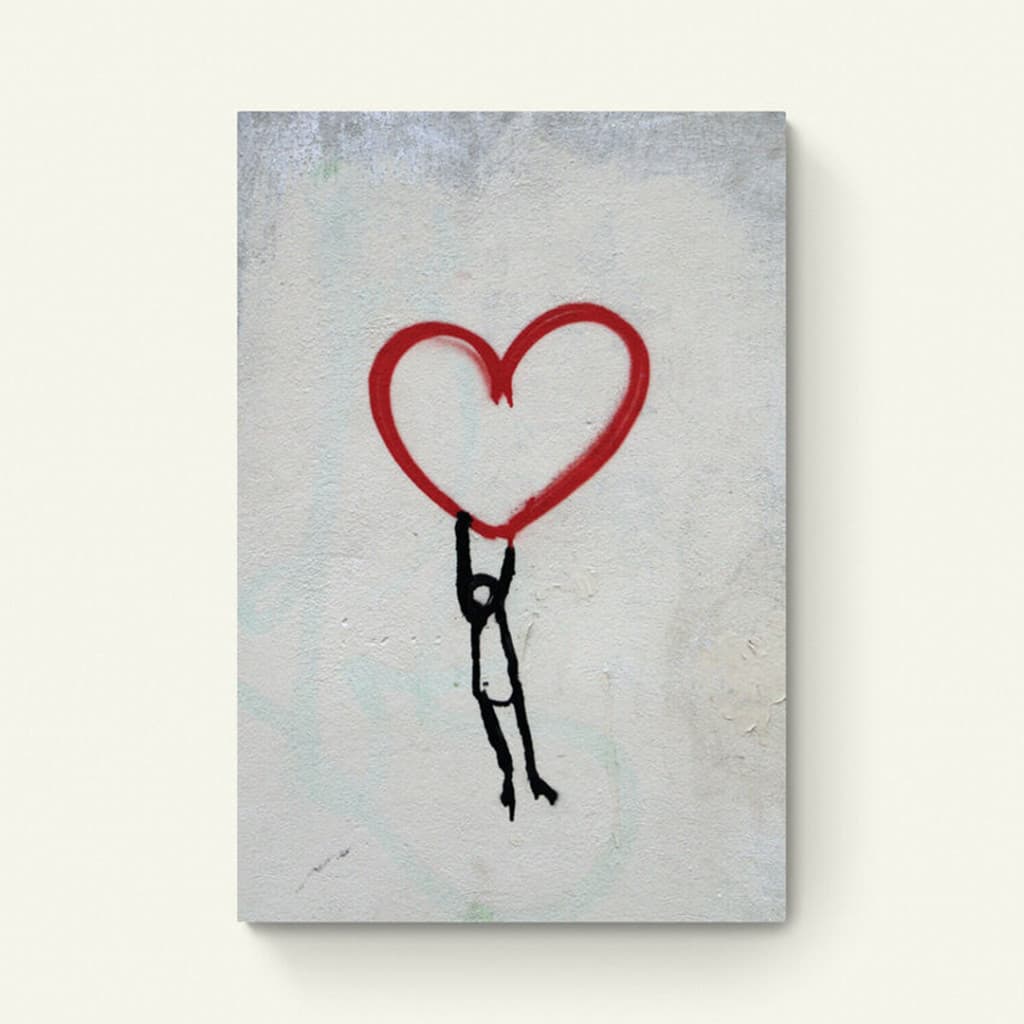 mannetje hangend aan een hart