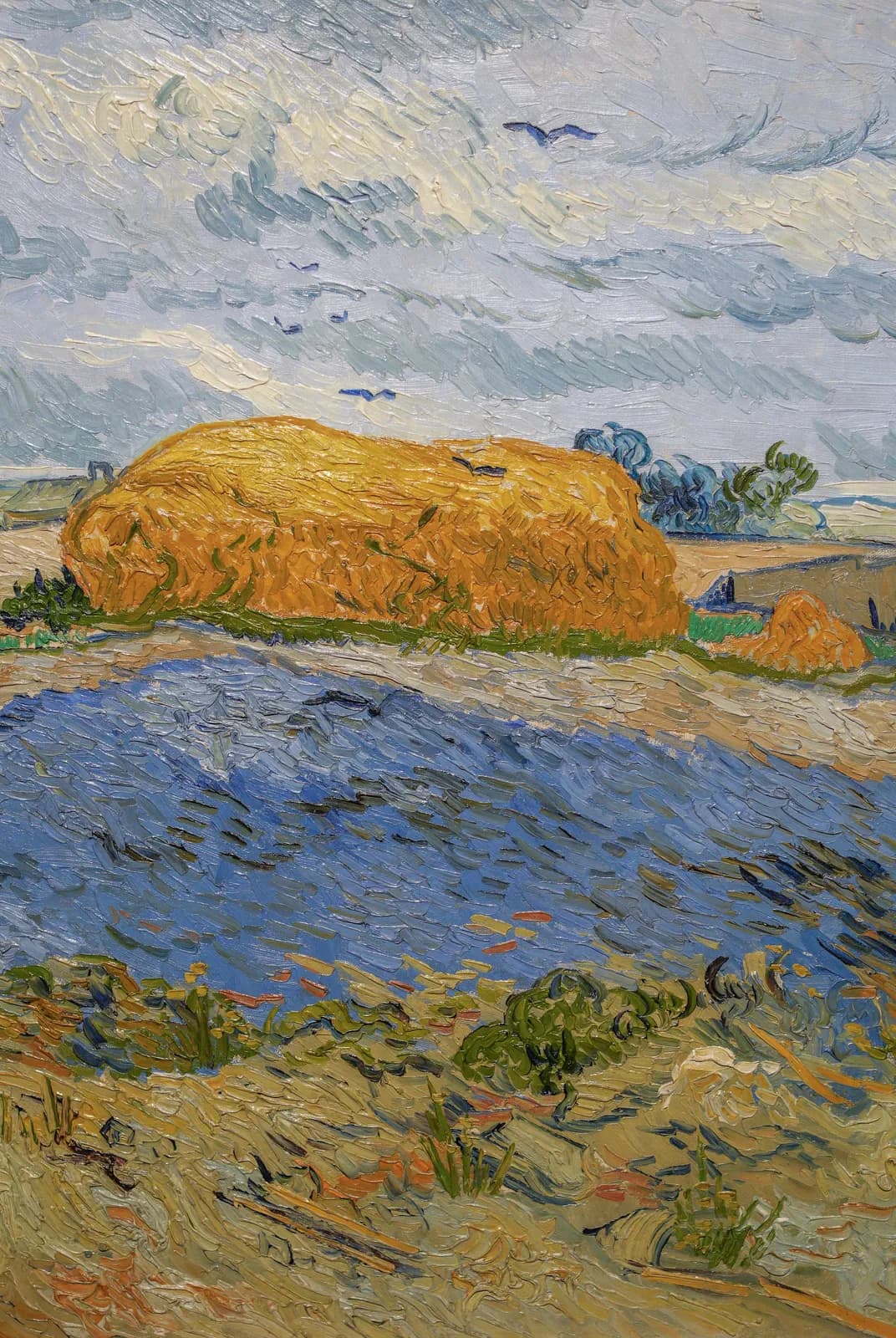 Korenschelf onder een bewolkte hemel – Vincent van Gogh