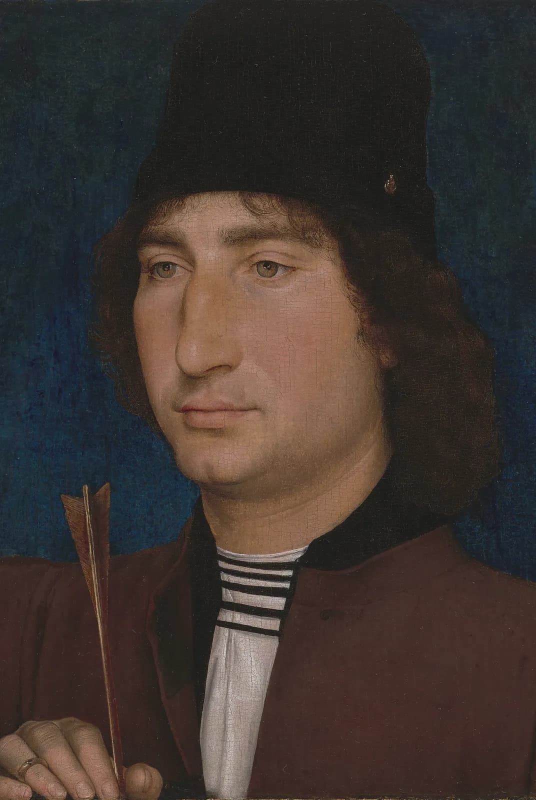 Portret van een man met een pijl – Hans Memling
